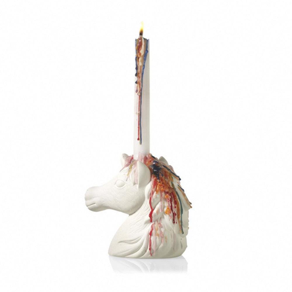 Bougie multicolore avec une licorne 